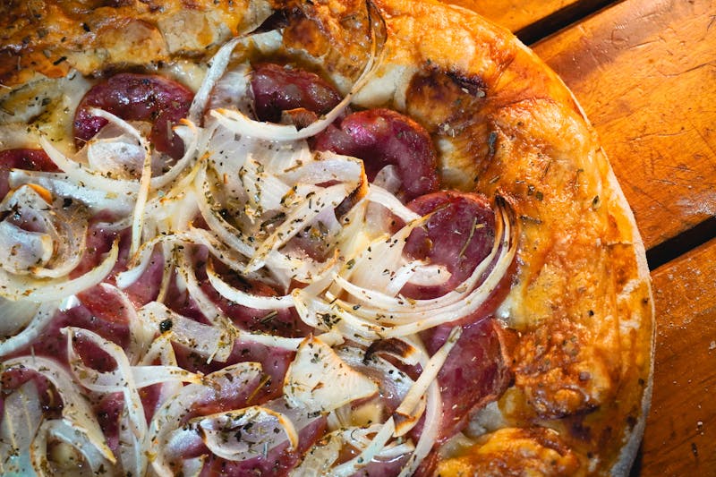 Meat lovers deep dish pizza with sausage and bacon