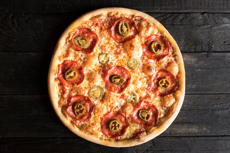 Spicy Diavola thin crust pizza with chili and salami