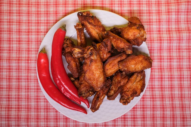 Crispy buffalo wings with celery and blue cheese dip