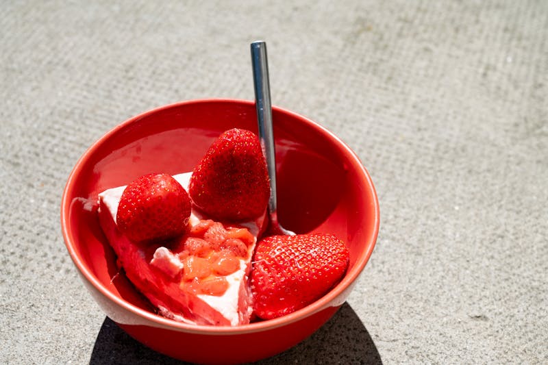 Rich New York style cheesecake with strawberry topping